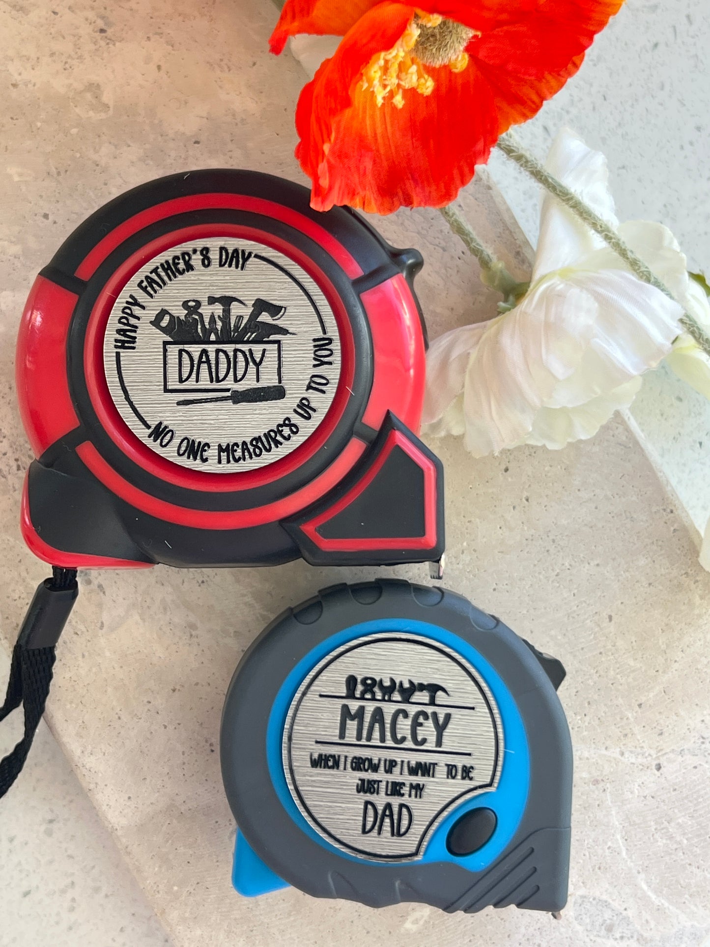 Two tape measures with personalised labels for Fathers Day