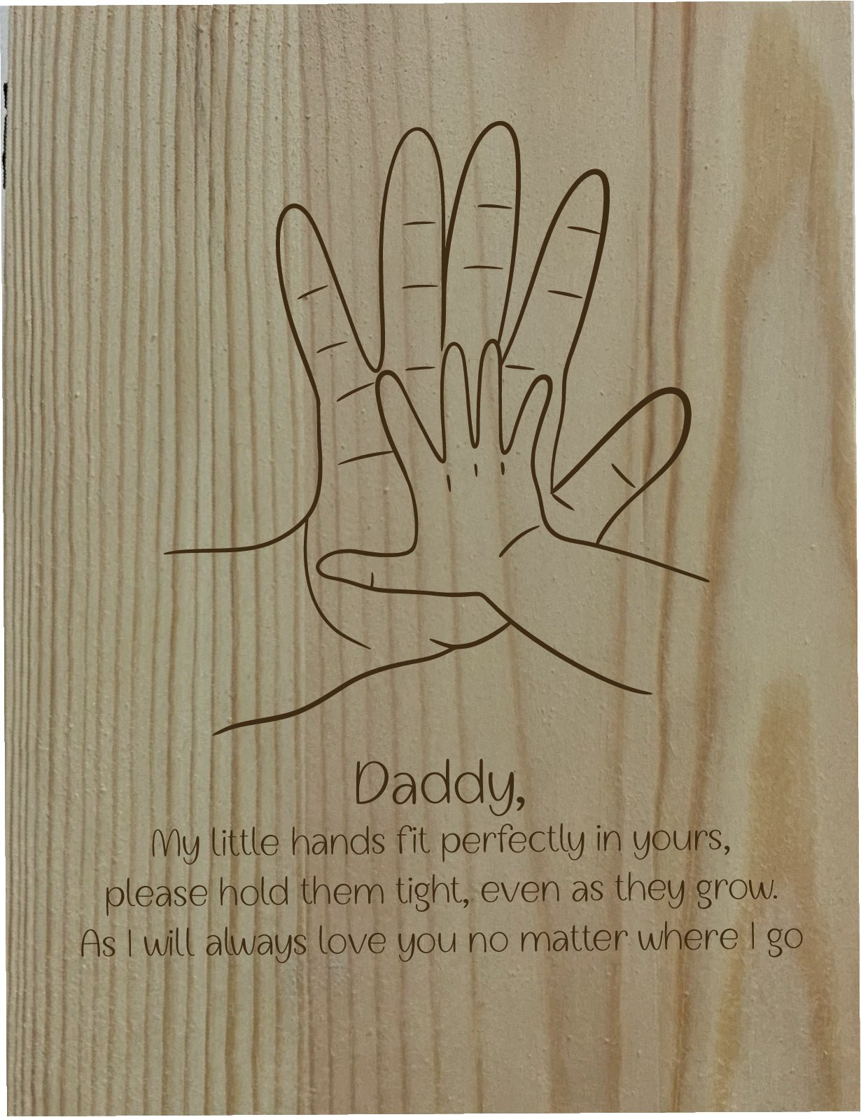 Wooden plaque with line drawing of two hands and a message on a wooden background