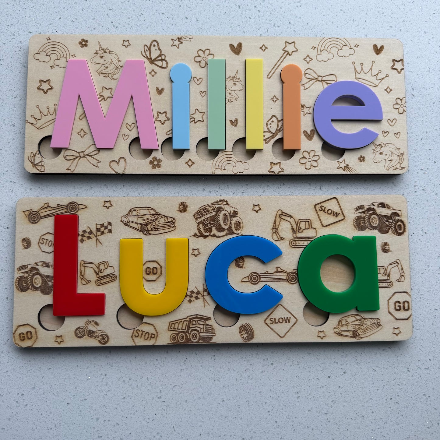 Wooden name boards with colourful letters spelling name 